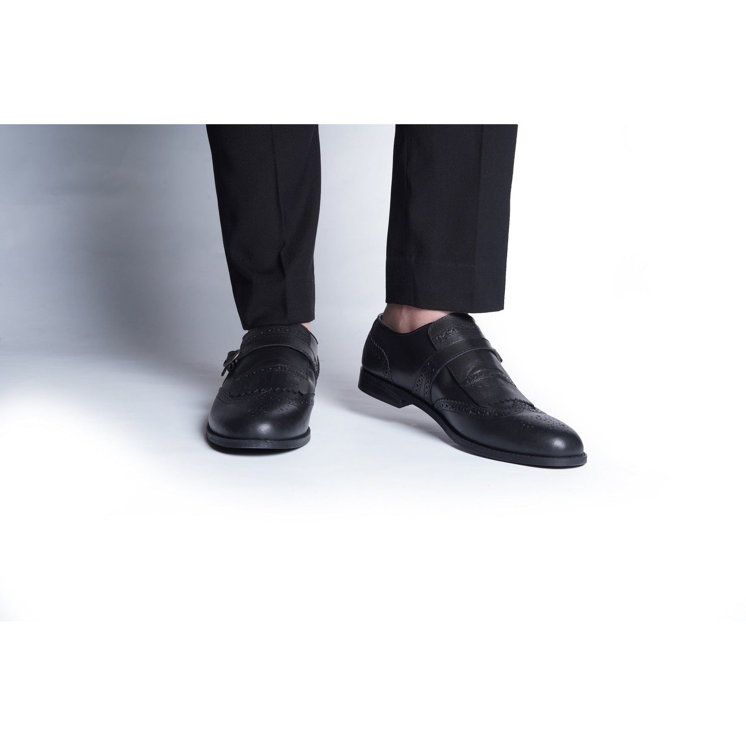 FRINGED BROGUE SLIP ONS - BLACK